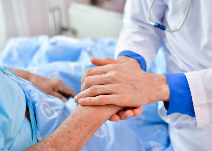 Concept of healing care. The doctor is healing old woman. The doctor is working in the hospital. Doctors encourage and treat elderly patient